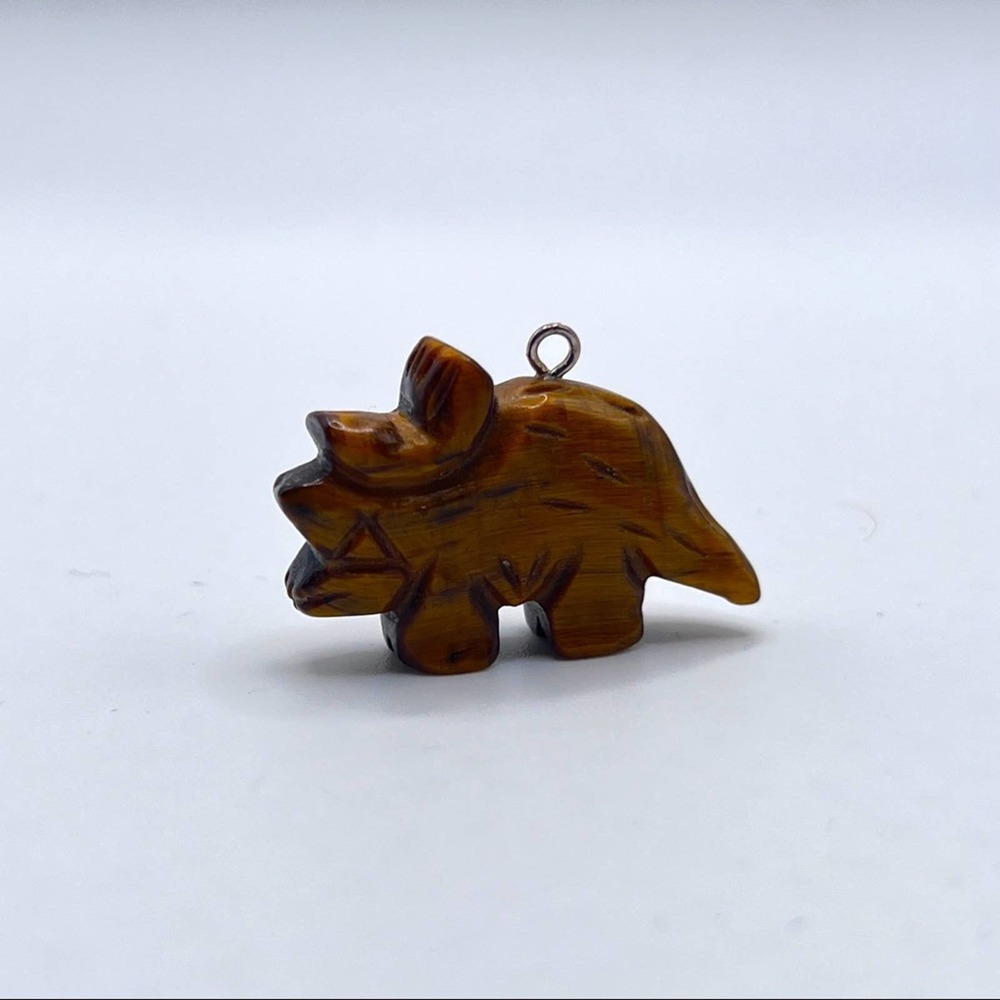 Dinosaur pendant. Brown tiger eye hand carved. Triceratops